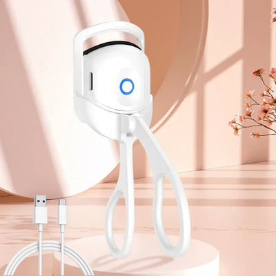 USB Heated Eyelash Curler in pink and white with anti-scald design, shown with before and after lash results for long-lasting curl.